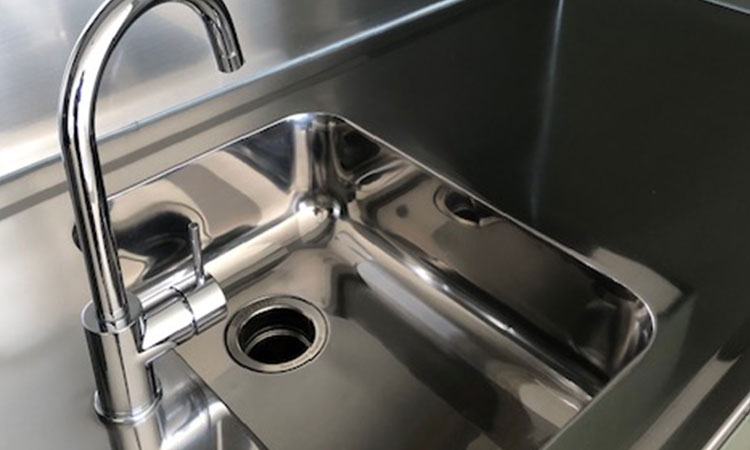 Polished stainless steel kitchen sink